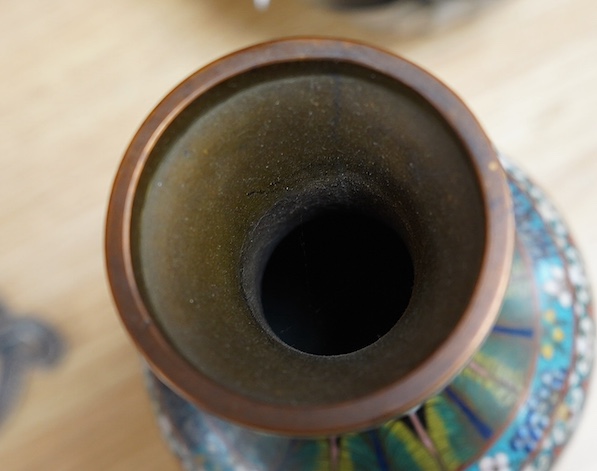 A pair of Chinese cloisonné black enamel ground vases, 23cm high. Condition - good.